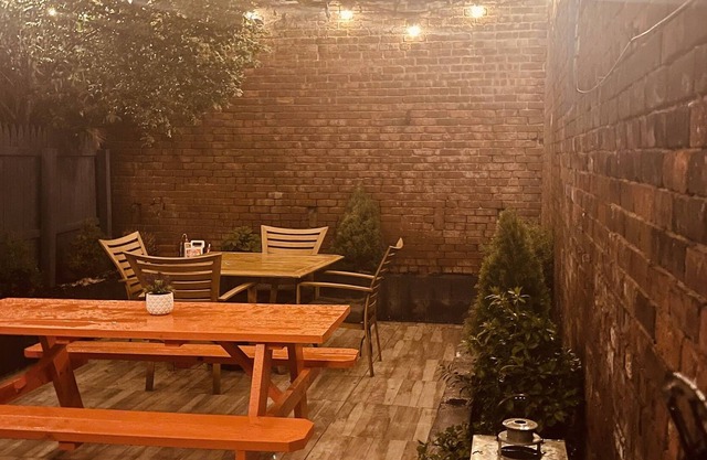 1850s historic Row House 7min train to NYC with private backyard