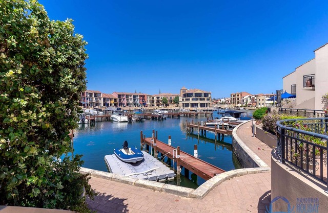 3BR townhouse in secure canal complex with double garage, walk