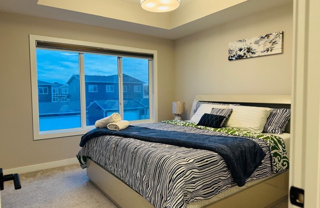 5 minutes to the chestermere lake! spacious family home.