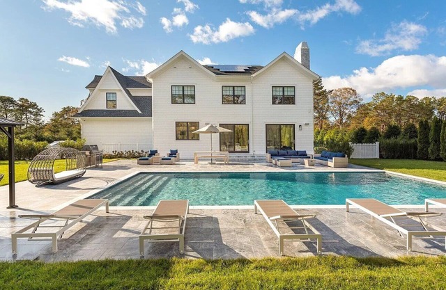 6,400 square foot traditional-style home with a private pool and sweeping...
