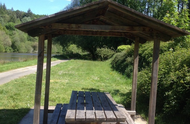 Adorable Breton Cottage with thatched roof and stone walls.