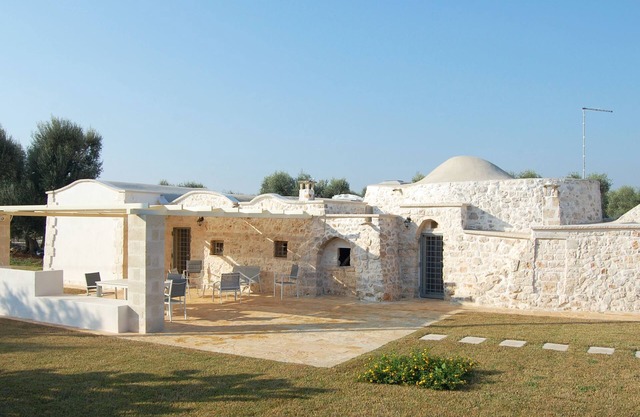 "Al Guappo D'oro," trullo with pool nestled in the Apulian countryside.
