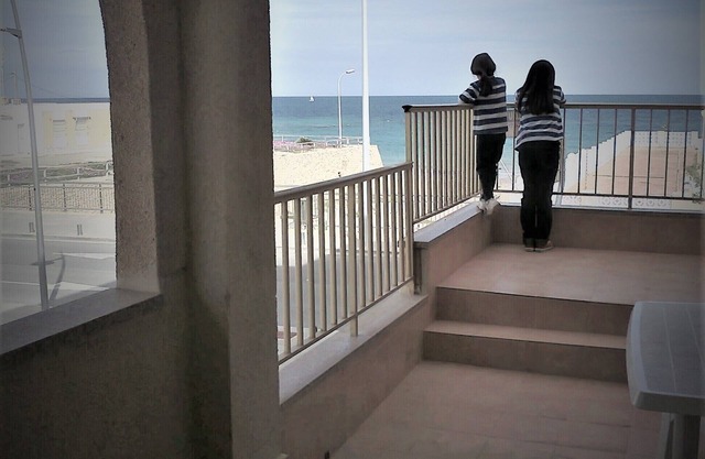 Apartment with large terrace by the sea, next to the beach
