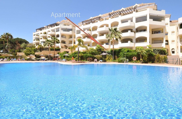 Apartment with large terrace, communal pool. Walking distance sandy beach!