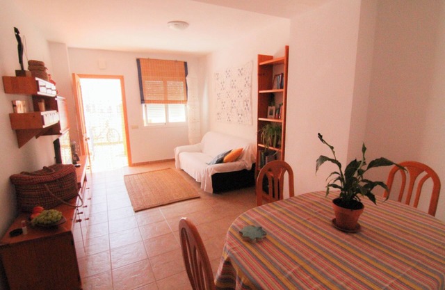 Apartment with pool near the beach and a park with sports facilities.