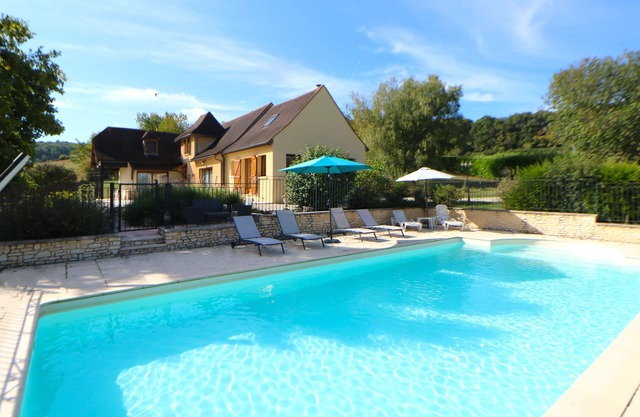 Attractive holiday home with private gated pool, large enclosed garden & views