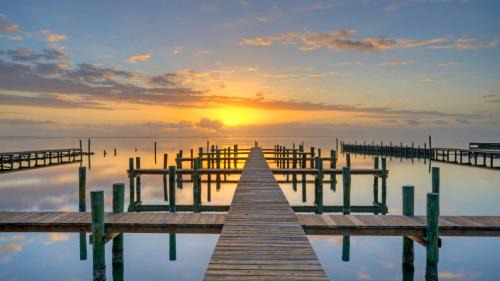 Balcony w Bay View Shared Pool Boat Dock Fat Flounder by AvantStay