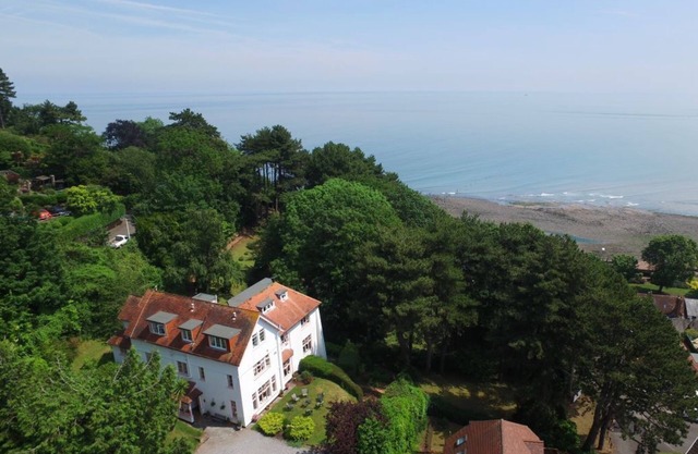 Beautiful family home sleeps 8- 12 perched above the sea on the edge of Exmoor.
