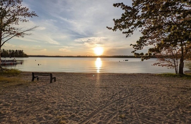 Beautiful home with 150ft sandy beach and private boat launch on Big Sebago!