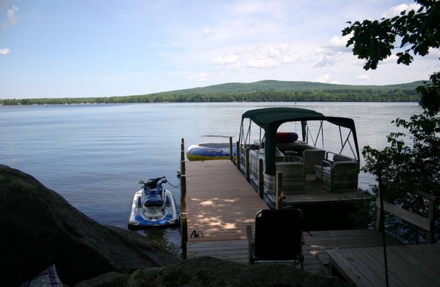 Beautiful log cabin on clear serene Province Lake with private beach.
