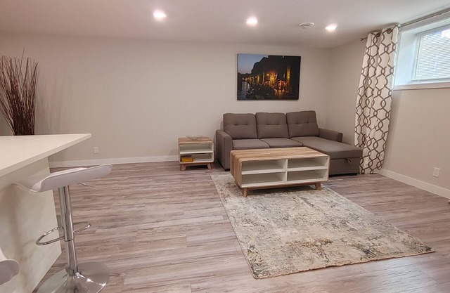 Beautiful two bedroom + den lower level suit