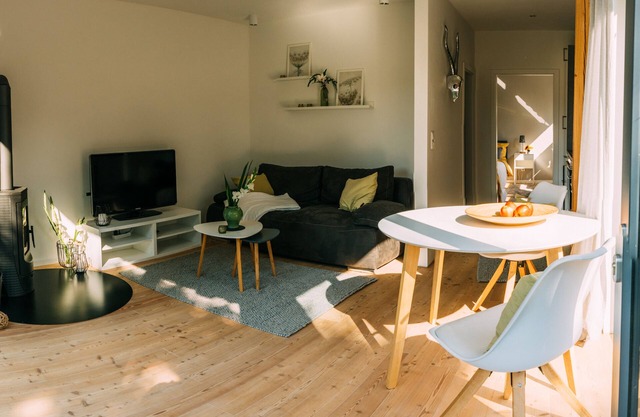 Beautiful vacation home in ecological timber construction in the Lüneburg Heath, equipped with fireplace, shower room, a beautiful garden with terrace and garden furniture/beach chair, Internet via W-Lan, bed linen and towels, spacious sleeping area and a