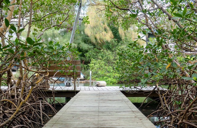 Canal-front home with a dock, GULF VIEWS, Shell Beach access.