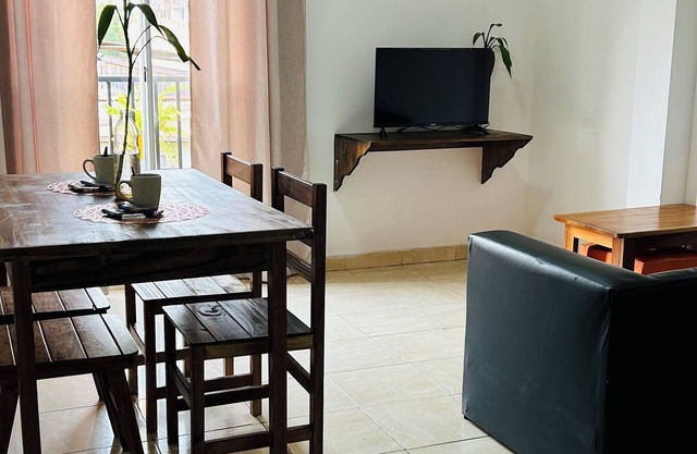 Centrally located room with living room and full kitchen-2C