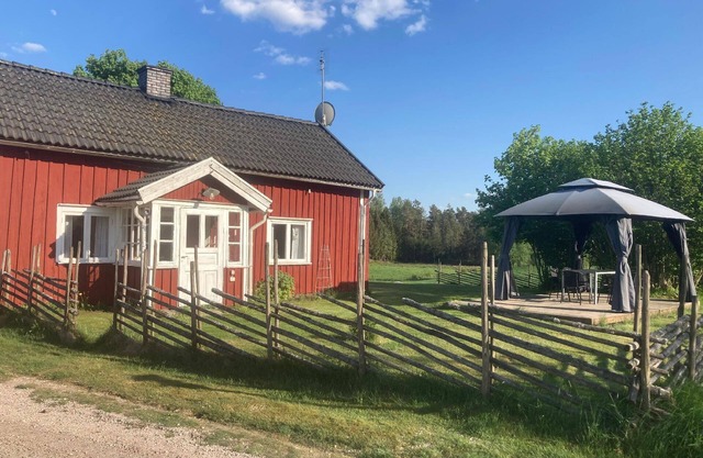 Charming wooden house with own rowing boat