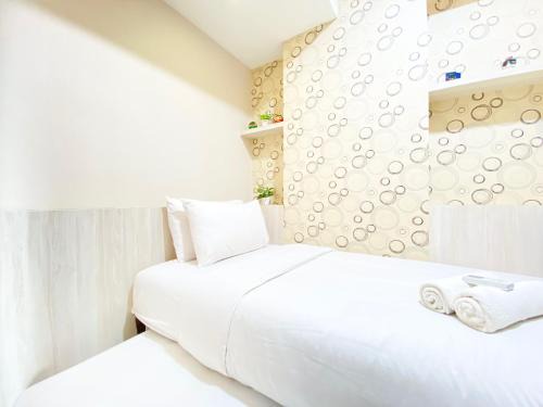 Chic and Cozy 2BR at Mekarwangi Square Cibaduyut Apartment By Travelio