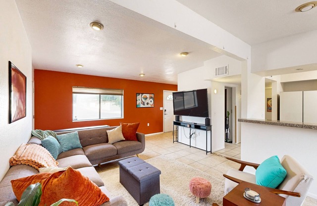 Colorful dog-friendly home with large fenced yard and firepit