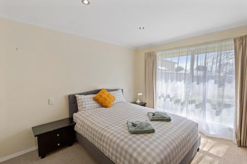 Comfortable 4-Bedroom Home with Backyard Escape