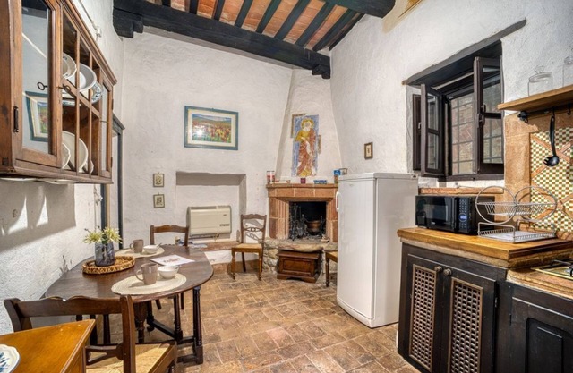 Comfortable apartment located in a historic Abbey from the year 1000, restored in 1980.La Badia is a small Benedictine Abbey immersed in a park of centuries-old olive trees.Located on the ground floor, there is a mezzanine for the sleeping area.There are