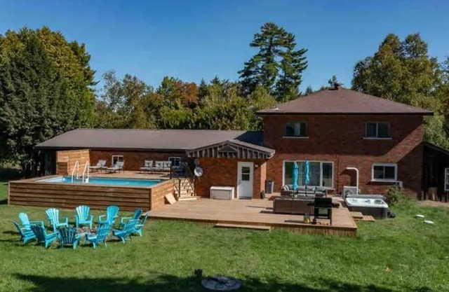 Comfortable cottage for 14 people with pool, hot tub, games, and more.