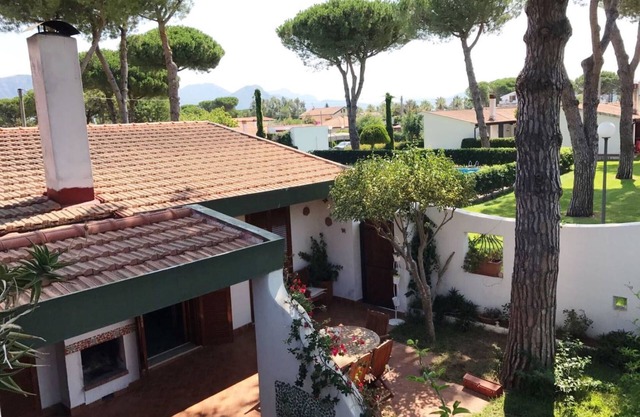 Comfortable villa with shared swimming pool surrounded by greenery near the sea
