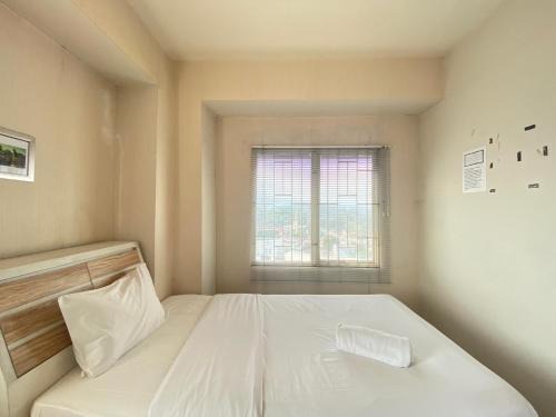 Cozy 2BR at Pinewood Apartment By Travelio