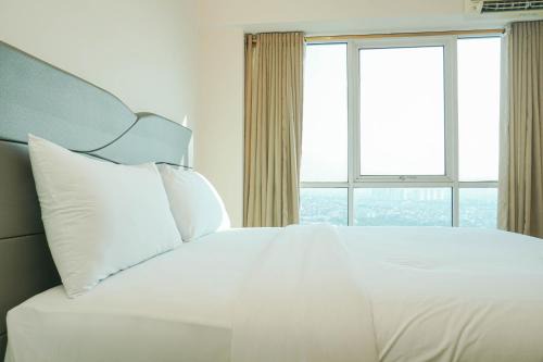 Cozy Living 1BR at Tifolia Apartment By Travelio