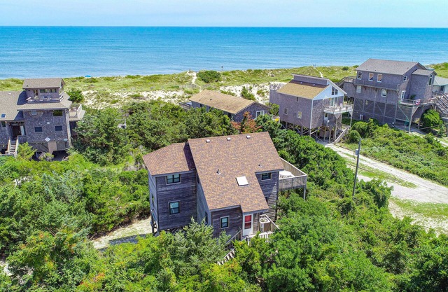 Cozy ocean-side home just steps from beach with pool access & central AC