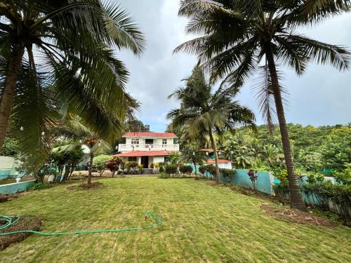 Cozy room in hill view villa with lush green lawn