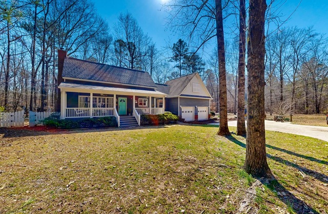 Creekside home with firepit, yard games, deck, wood stove, & W/D