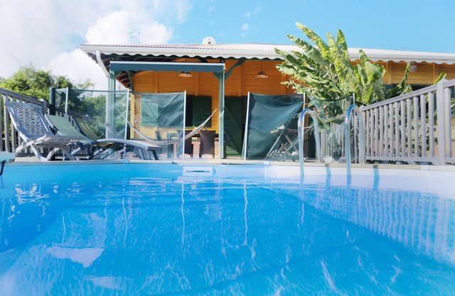 Creole villa with shimmering colours and a pool