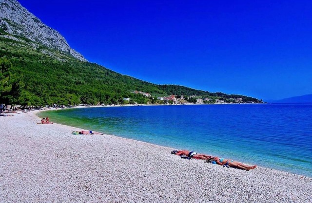 DREAM LOCATION! Only 20 m to the beach. Apartment with air conditioning, WLAN, garden, parking lot