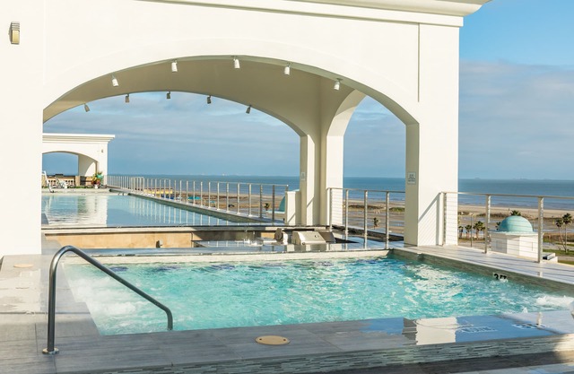 Elegant gulf escape with heated pool, hot tub, beach access, & water views