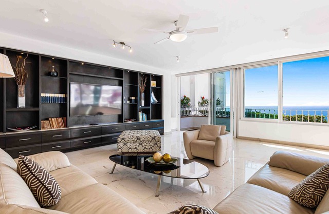 Elegant multi-level penthouse with rooftop Jacuzzi, bay views, pool & game room