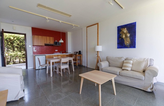 Eucrasia | One-Bedroom Apartment, Art by PraXis Apartments