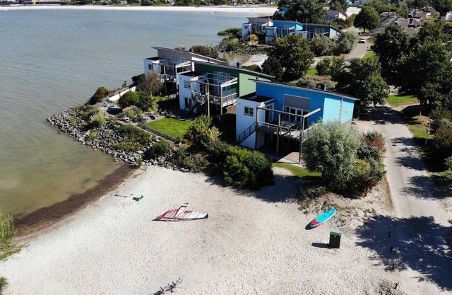 Exclusive 8-person Deluxe beach villa with panoramic views, freestanding bathtub, and steam shower cabin at Beach Resort Makkum on the IJsselmeer.