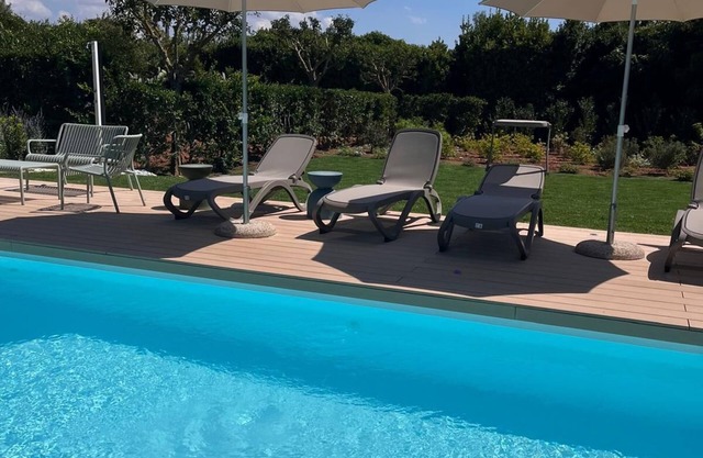 Exclusive villa with swimming pool surrounded by greenery