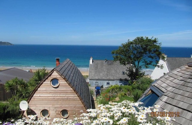 Feet in the water, wooden house with terrace, breathtaking sea view.