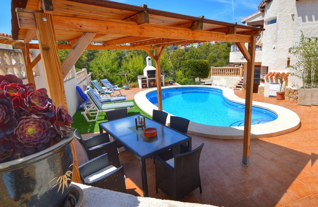 Fiesta~Siesta in this easy to access Moraira home with unique bedrooms and BBQ