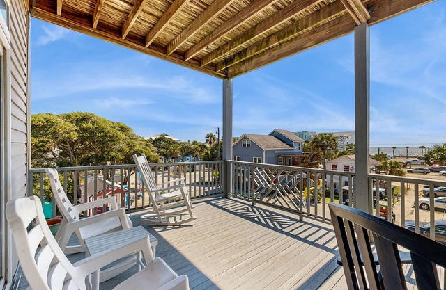 First-floor villa w/partial ocean views, covered porch -one block from the beach