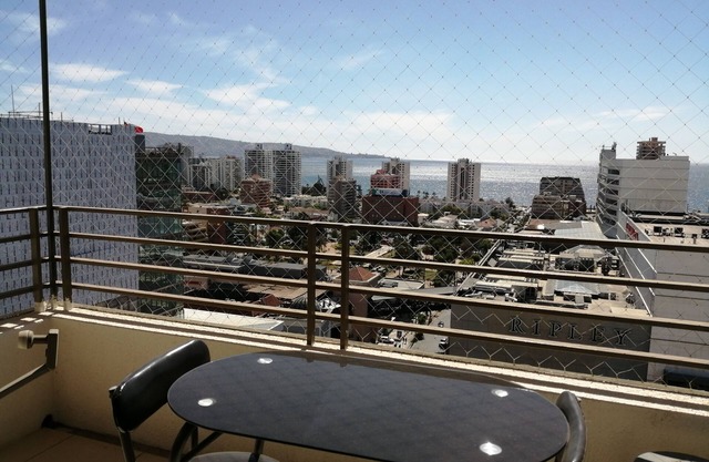 Furnished apartment with sea view and coastal edge.
