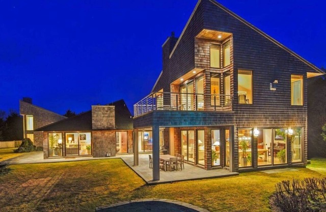 Glam-style home with private pool, open-floor plan, floor-to-ceiling.