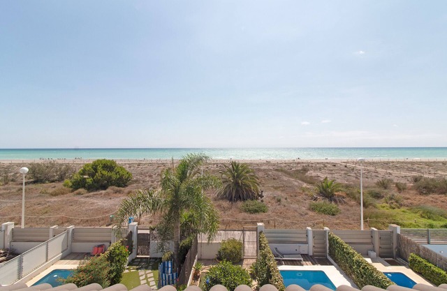 Global Properties: Front line beach townhouse with sea views