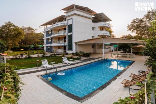 Grey Hues with Swimming Pool & Lawn at Karjat by StayVista