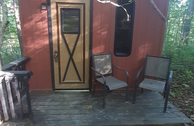 Hike to your tiny cabin in the woods, we will leave the solar lights on for you.