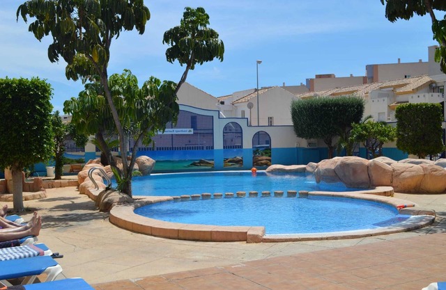 Holiday Apartment "En El Cabo Roig" with Shared Pool, Private Balcony & Wi-Fi