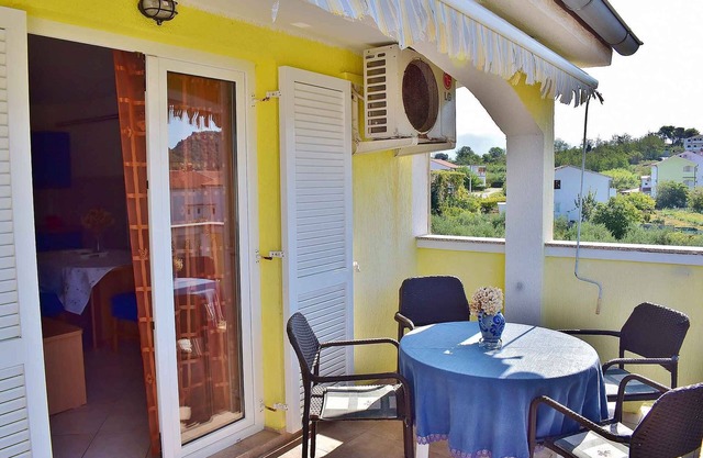 Holiday apartment with balcony and air conditioning