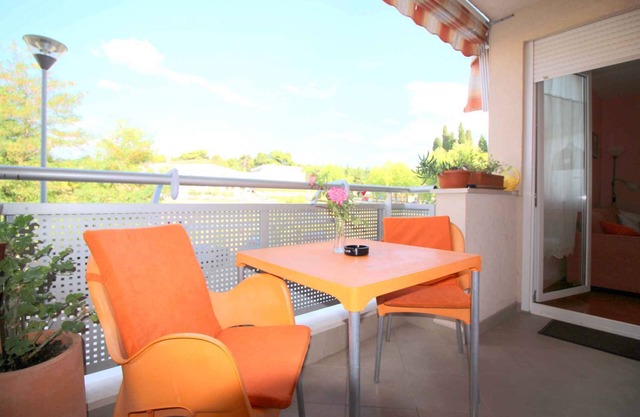Holiday apartment with balcony and air conditioning