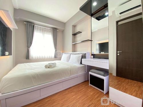 Homey 2BR Apartment at Mekarwangi Square Cibaduyut By Travelio