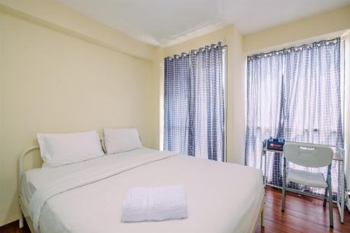 Homey and Cozy Living Studio Room at Tifolia Apartment By Travelio